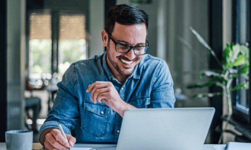 happy man looking at Laptop